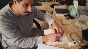 Miguel writing braille